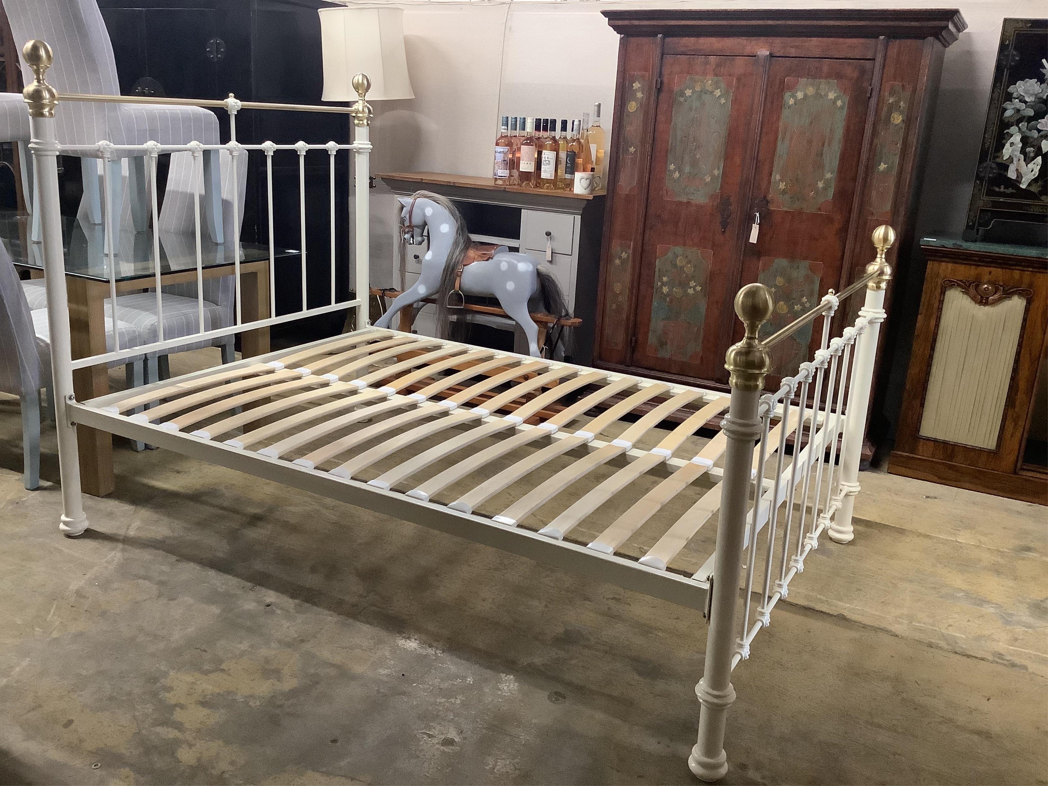 A modern Victorian style brass mounted double bedframe, width 140cm, length 200cm, height 140cm. Condition - good